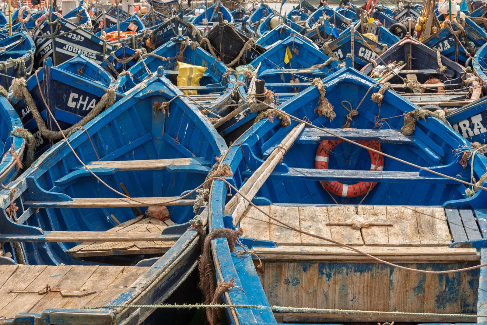 Blue fishing boats in the harbor of Essaouira, Morocco